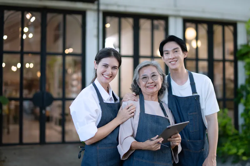 Mother, son and daughter working together in their family restaurant